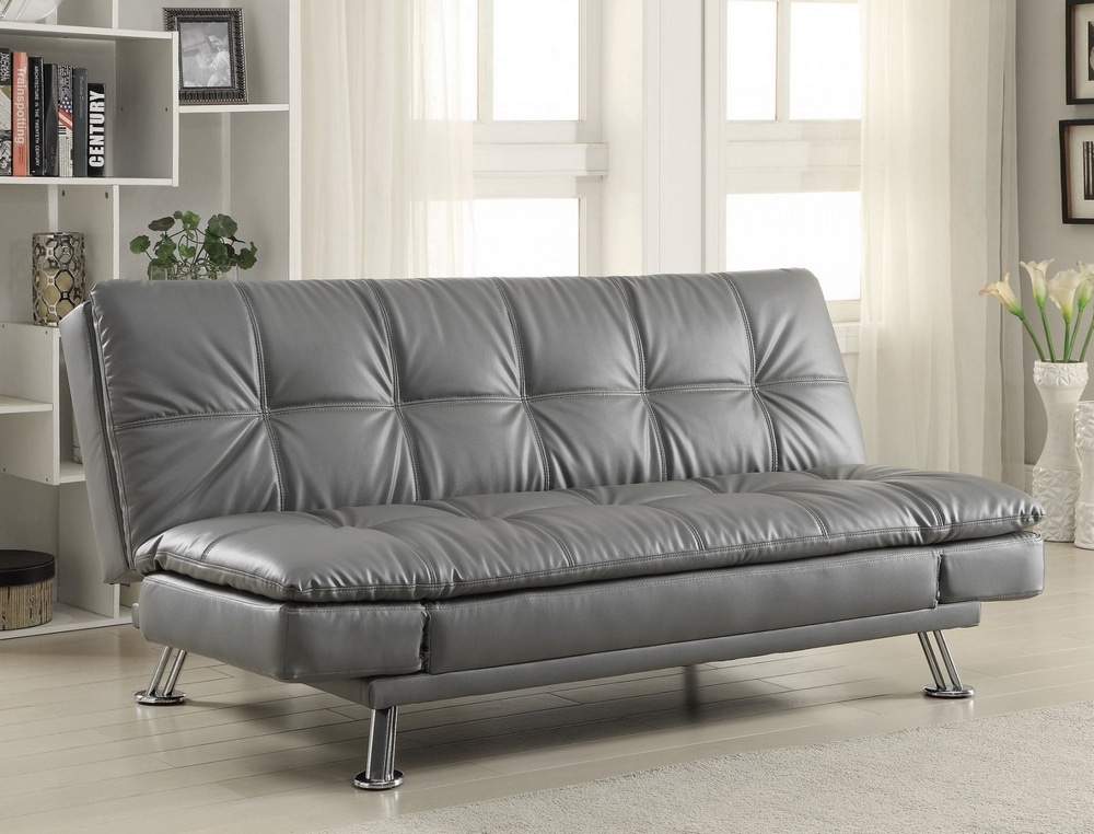 Modern gray leather sofa with metal legs in a bright and well-decorated living room
